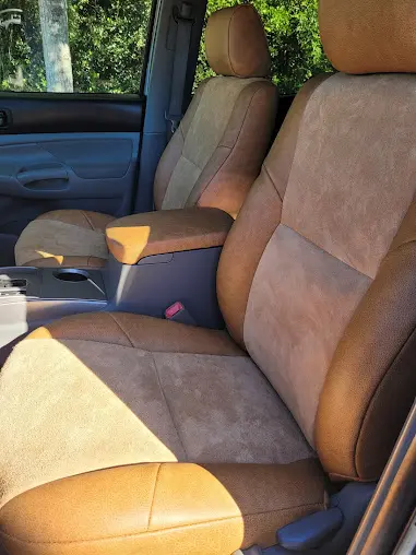 Front seats and center console of a Toyota Tocoma reupholstered with leather