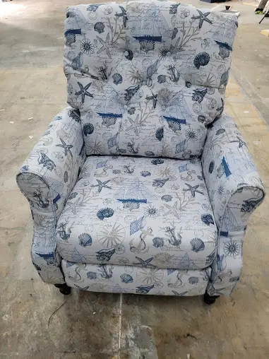 Sofa reupholstered with ligh fabric with a sea based theme